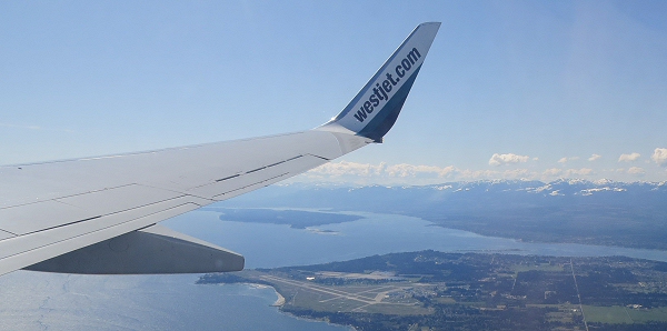 view of CFB Comox after take-off, Beaufort range on Vancouver Island in the background